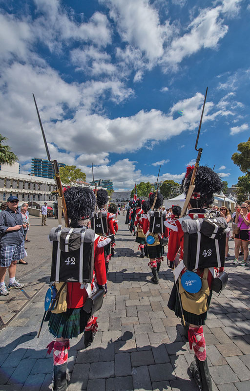 Members of the Reenactment society march dressed in traditional British uniforms, used 300 years ago.
